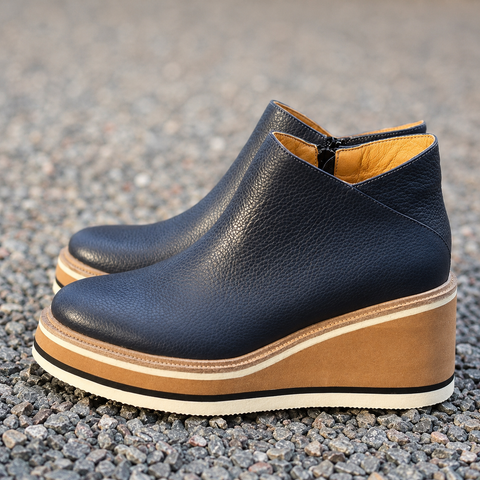 Women's ankle boots worn outdoors with jeans