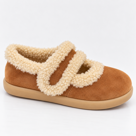 Womens slippers suede fur lined with fluffy strap on a cozy rug