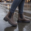 Chelsea boots for women wide fit worn with jeans on a city sidewalk