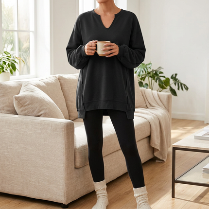 Oversized V neck tunic sweatshirt for women worn with leggings, front view