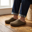 Knit clogs for women with cork footbed on a wood floor