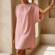 Mock neck batwing midi dress for women with split sleeves in a warm interior