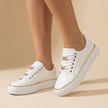 White platform sneakers for women with gold chain lace detail