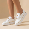 White platform sneakers for women with gold chain lace detail