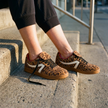 Women's leopard sneakers, retro low top lace up shoes on front steps