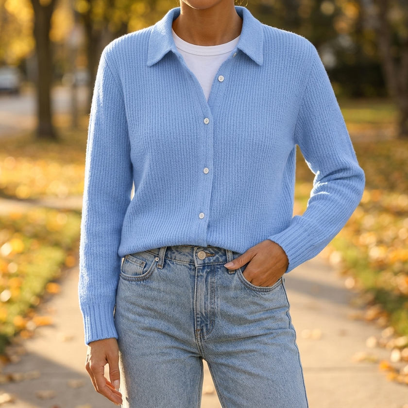 Women's collared button up cardigan sweater worn on an autumn sidewalk