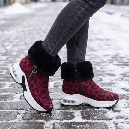 red leopard fur lined ankle boots for women on a snowy street