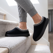 House shoes for women in black, walking down stairs