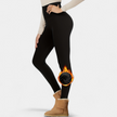 Fleece lined leggings for women worn with a long sweater and ankle boots