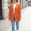 Lightweight open front knit cardigan for women worn over a white tee and denim